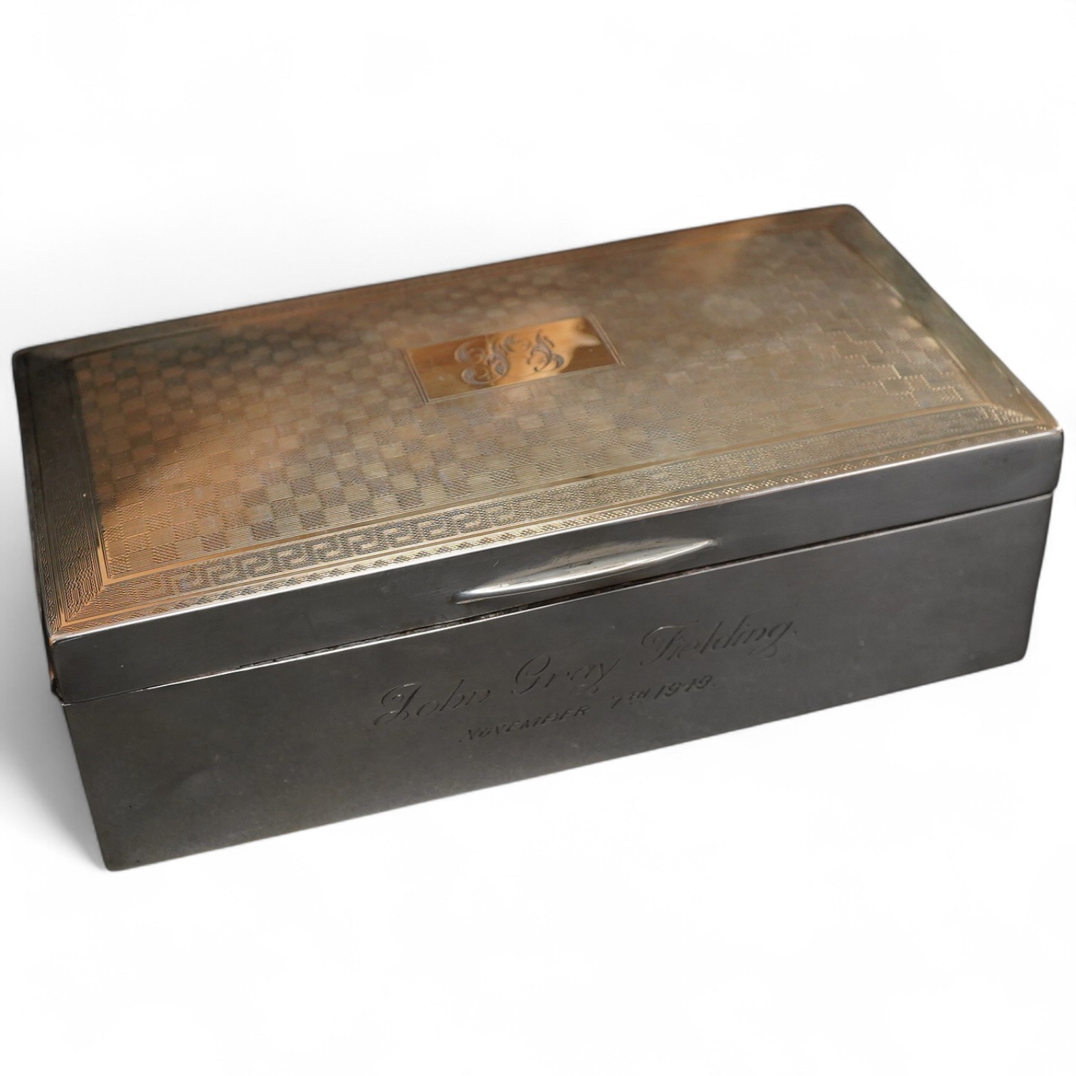 A George V part engine turned silver mounted rectangular cigarette box, with engraved inscription, J.B. Chatterley & Sons, Birmingham, 1925, 16.5cm.